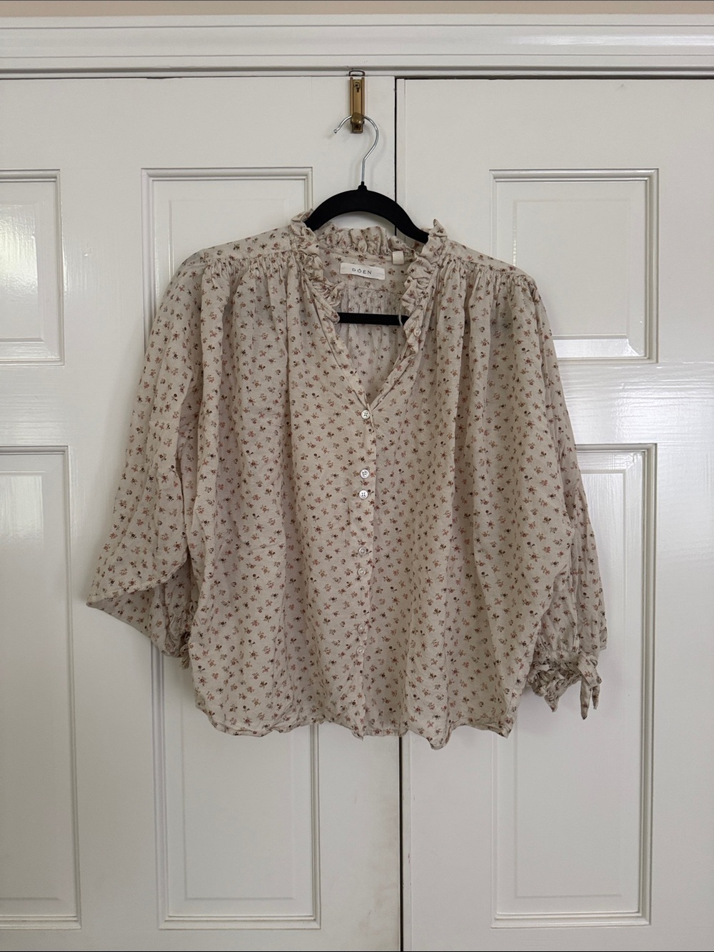 Chic Cream Blouse with Tiny Floral Print and Ruffle Neck